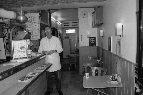 Peter Müller in his restaurant 'Henny's Gute Stuben' (= 'Henny's Parlor')