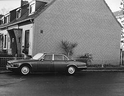 A big Jaguar sedan in a turning area in our estate of terraced houses