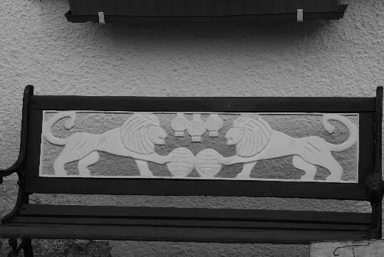 a banquette the backrest of which was decorated with lions
