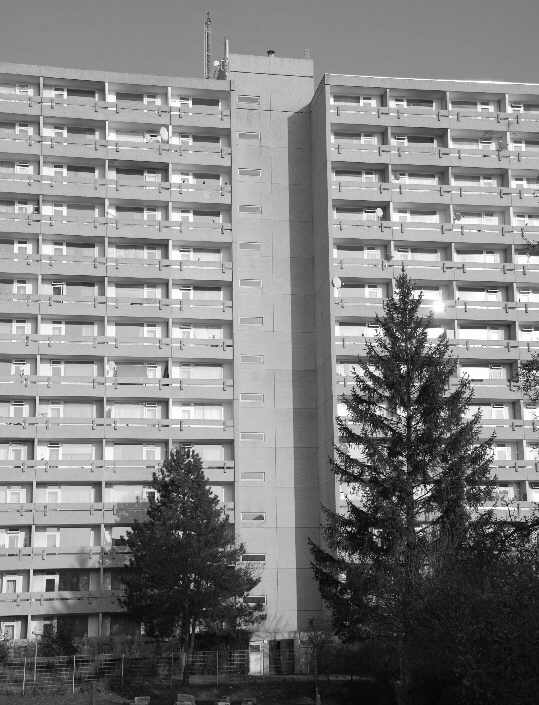 High-rise residential building as viewed from a small path
