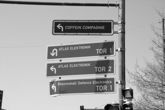 signpost, which stands at the road 'Seebaldsbrücker Heerstraße' and points out entrances of other big industrial plants such as war factories and food industry plants