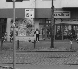 A man from Romania(?) played the accordion at the entrance of a hypermarket.